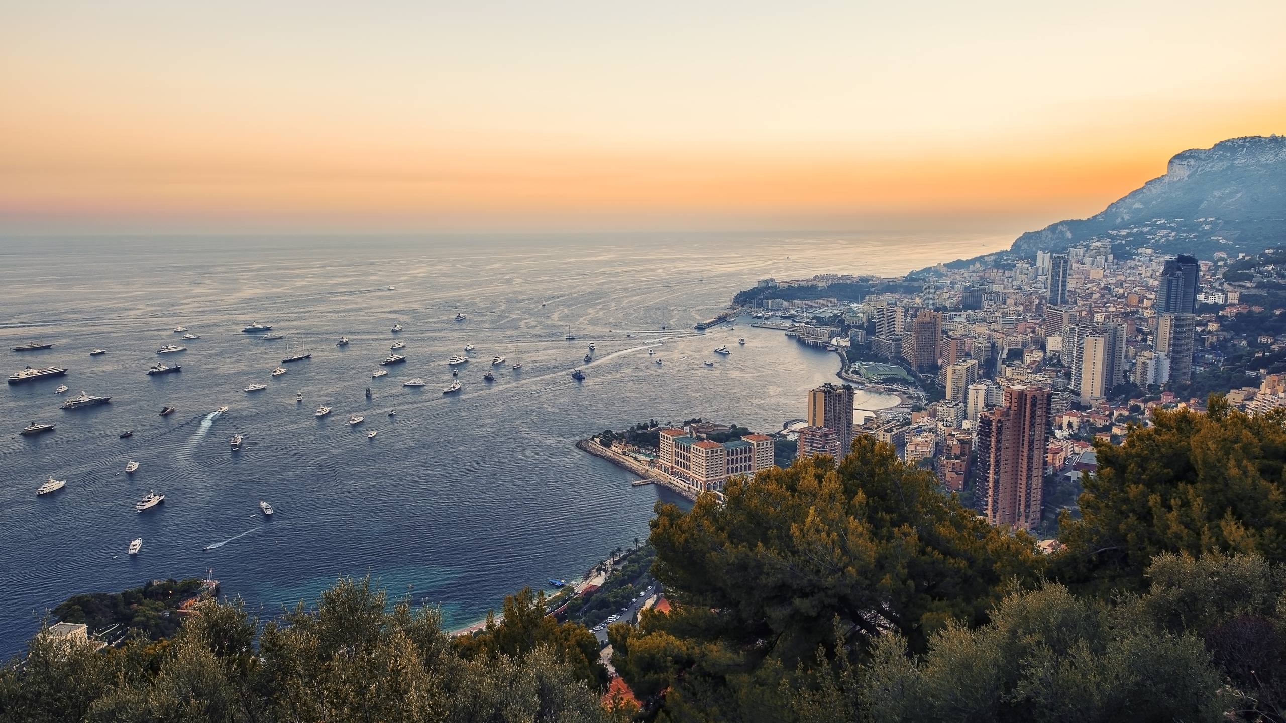 The superyacht fleet at anchor off Monaco at dusk